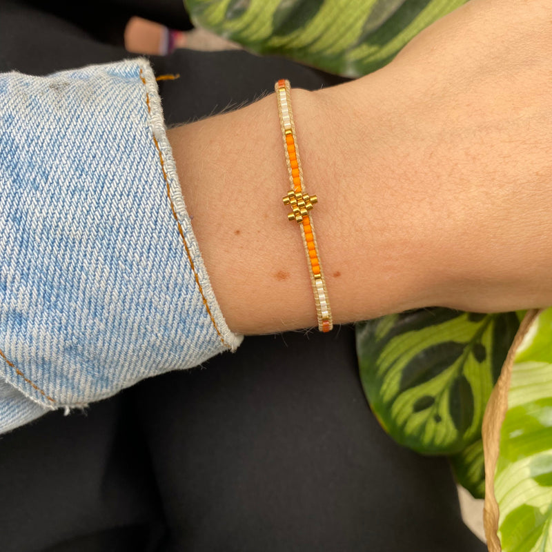 HANDWOVEN HEART BRACELET IN ORANGE AND GOLD