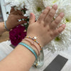 HANDMADE  KIDS FLOWER BRACELET IN TURQUOISE ON MODEL