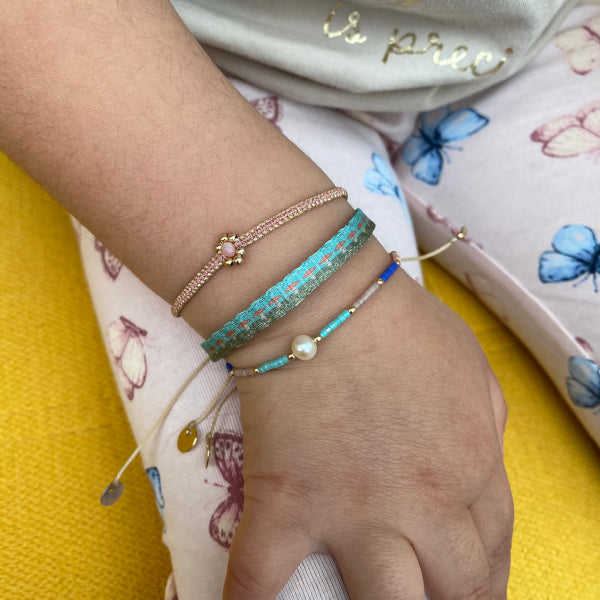 HANDMADE PEARL DEATIL KIDS BRACELET ON MODEL