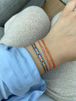 SINGLE HANDWOVEN BRACELET IN ORANGE & SILVER