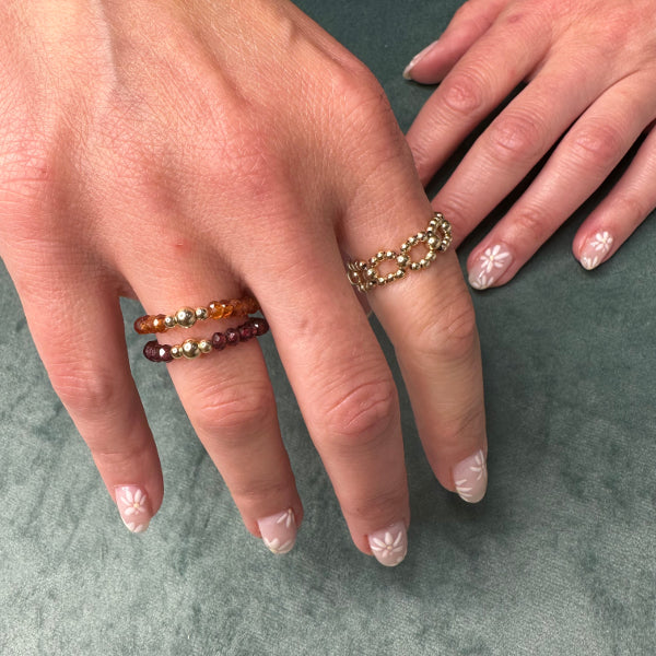 RHODOLITE RING WITH GOLD DETAILS