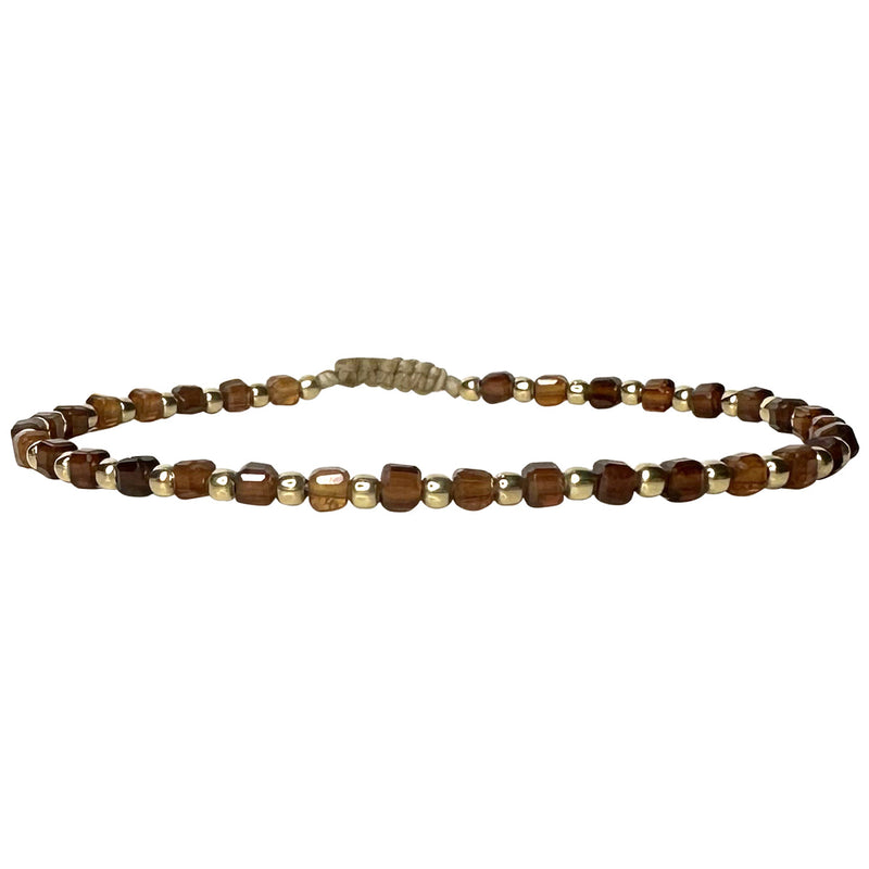 This delicate jewel is handmade using 14kt gold filled beads and hessonite semi-precious stones. This beauty will be one of your favorite bracelets as you can wear it with any accessories or outfits. Give to your looks a touch of elegance and sparkle !  Details:  - Hessonite semi-precious stones   - 14kt gold filled beads  -Adjustable bracelet  -width: 2mm