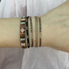 SET OF THREE BRACELETS IN BLACK AND NUDE TONES