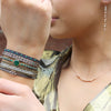 HANDWOVEN 3 FLOWER BRACELET WITH SILVER DETAILS IN PINK TONES