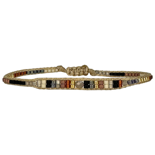 beads in brown tones with a peach sunstone in the centre  Wear this stylish bracelet alone or as a part of a bracelet layering combination, with your favourite jeans & t-shirt!  Details:  - Japanese glass beads  - Peach sunstone  - Width: 2mm  - Adjustable bracelet   -Can be worn in the water