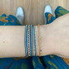 HANDWOVEN BRACELET WITH THREE TURQUOISE STONES