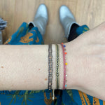 HANDWOVEN THREE STONE BRACELET IN BLACK AND GOLD TONES