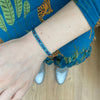 COLOURFUL HANDWOVEN BRACELET IN AQUA TONES AND SILVER DETAILS