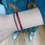 INTERMIXED HANDWOVEN BRACELET IN RED AND GREY TONES