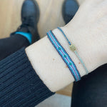 HANDWOVEN BRACELET WITH IN BLACK TONES THREE GREEN ONYX STONES