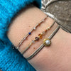 GYPSY HANDMADE BRACELET WITH INTERMIXED SEMI-PRECIOUS STONES AND GOLD DETAILS IN NEUTRAL TONES