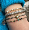 HANDMADE BEADED BRACELET IN COPPER AND GREY TONES WITH GOLD DETAILS
