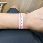 This magnificent design is handwoven using 160 threads, it takes for our master artisans 1 hour and 20 minutes to weave each bracelet. Details:  - Handwoven using Polyester  - Can be worn in the water - Width 8 mm  -Adjustable bracelet  -Women bracelet -Pride bracelet