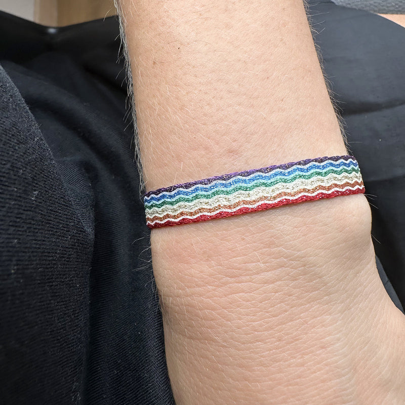You are powerful, strong and creative. You are capable of great things. You have the ability to create anything you want in your life. This magnificent design is handwoven using 160 threads, it takes for our master artisans 1 hour and 20 minutes to weave each bracelet. Details:  - Handwoven using Polyester  - Can be worn in the water - Width 8 mm  -Adjustable bracelet  -Women bracelet -Pride bracelet
