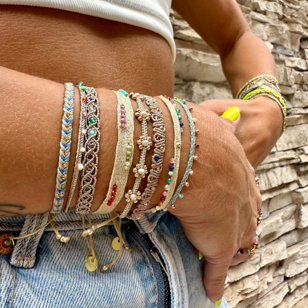 If you wish for simple elegance and versatility this handmade bracelet is just for you. It is handwoven by our team of artisans using intermixed semi-precious stones, 14K rose gold filled beads and metallic threads.  Details:  - Women bracelet  - Rose gold filled beads  - Semi precious stones  -Adjustable bracelet  -Width: 5mm  -Can be worn in the water