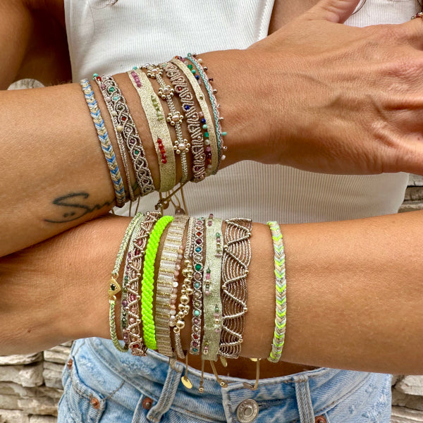 This elegant bracelet is designed for everyday wear. Its simple design, as well as its versatility, make it a perfect gift for any occasion.  It's Set With a Beautiful Array Of intermixed semi-precious stones and handwoven using polyester threads.   Details:  -Intermixed semi-precious stones  -Handwoven using polyester threads  -Adjustable bracelet   -Width:0.7 cm   -Can be worn in the water