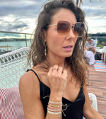 This LeJu bracelet has been handwoven in Colombia by our team of artisans using polyester threads in gold tones and silver tones, vermeil beads and intermixed semi-precious stones that gives you love and confort.  Details:  - Pink tourmaline semi-precious stones  - Gold vermeil beads  - Handwoven using polyester threads  - Width 4mm  -Women bracelet  - Adjustable bracelet  -Can be worn in the  water
