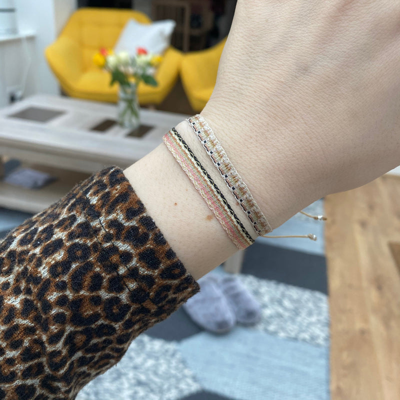 BASIC HANDWOVEN BRACELET IN TONES OF PINK, GOLD & BLACK