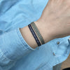 BASIC HANDWOVEN BRACELET IN TONES OF BLUE, BEIGE & GOLD