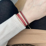 BASIC HANDWOVEN BRACELET IN RED, GREY, BLACK & GOLD