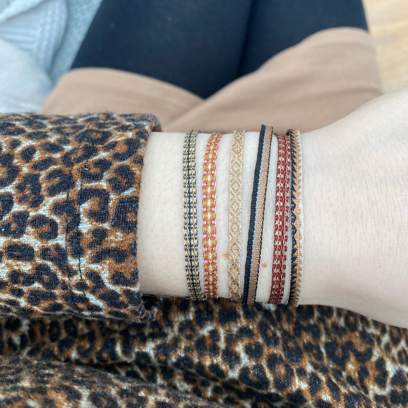 BASIC HANDWOVEN BRACELET IN TONES OF ORANGE, BEIGE & GOLD