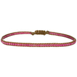 Handwoven in Colombia, this feminine bracelet features a single row of Japanese glass beads.  Wear this stylish bracelet alone or as a part of a bracelet layering combination, with your favourite jeans & t-shirt!  Details:  - Japanese glass beads  - Width: 2mm  - Adjustable bracelet   -Can be worn in the water