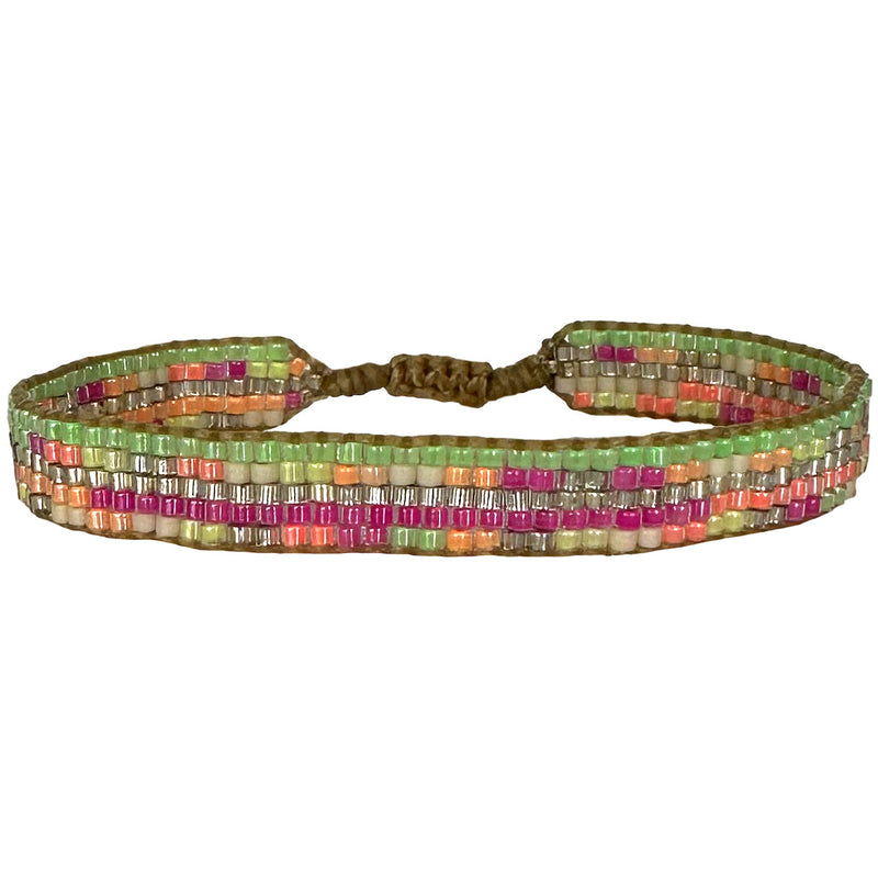   This cool bracelet is handwoven by our team of artisans in Colombia using Japanese glass beads.   Wear it with your favourite accessories !  Details:      Japanese glass beads     Handwoven adjustable bracelet     Width 9mm     Can be worn in the water