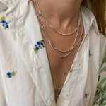 HANDMADE NEACKLACE FEATURING BEAUTIFUL PEACH, LILAC AND WHITE PEARLS ON MODEL