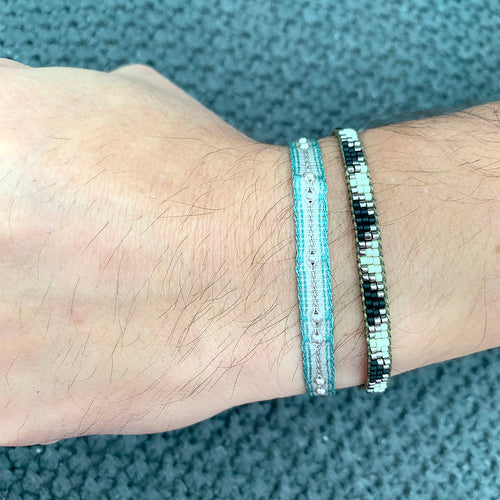 HANDWOVEN BRACELET WITH 9 STERLING SILVER BEADS IN NEUTRAL BLUE TONES
