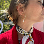 This gorgeus hoop earrings are so simple and femenine. Handmade by our team of master artisans using a vermeil hoop decorated with a delicated freshwater pearl.     Details:  - Handmade earrings  - 24k Gold vermeil Hoop on 925 sterling silver   -Hoop diameter: 25mm, lenght: 48 mm  -Freshwater pearls  -Vermeil Beads