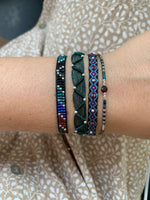 SET OF THREE HANDWOVEN BRACELETS IN DARK TONES WITH SILVER DETAILS