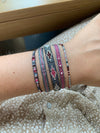 SET OF THREE PINK AND GREY BRACELETS WITH SILVER DETAILS