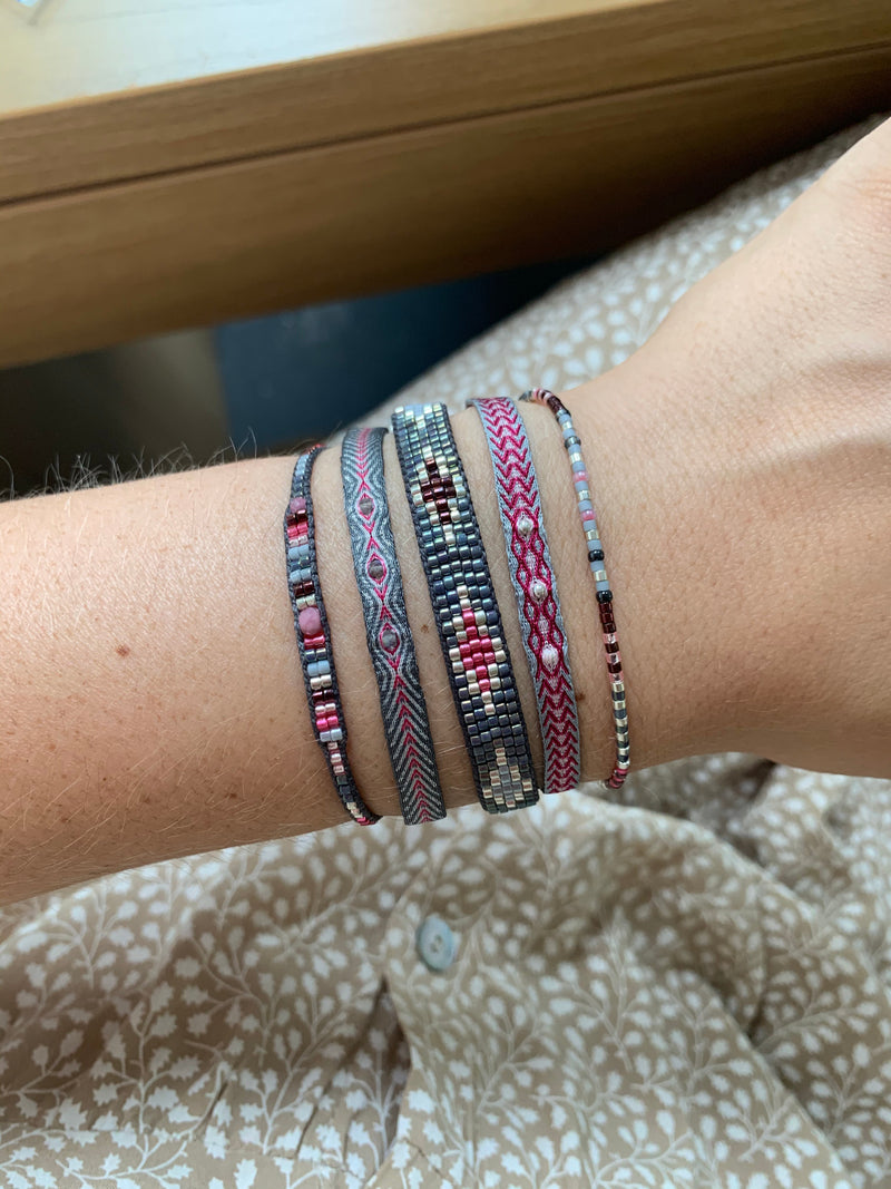 SET OF THREE PINK AND GREY BRACELETS WITH SILVER DETAILS