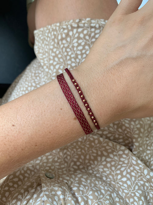 SET OF TWO HANDWOVEN BURGUNDY AND GOLD BRACELETS