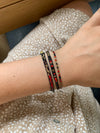 SET OF THREE HANDWOVEN BEADED BRACELETS IN GOLD AND RED