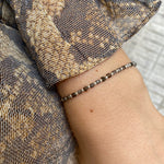 SCARLETT HANDMADE BRACELET FEATURING GOLD OBSIDIAN STONES AND SILVER BEADS