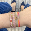 BASIC HANDWOVEN SPARKLE BRACELET IN PALE PINK AND ORANGE TONES