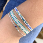 BASIC HANDWOVEN BRACELET IN TONES OF GREEN, PALE BLUE AND YELLOW