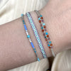 HANDWOVEN BASIC BRACELET IN PURPLE, GREEN AND YELLOW