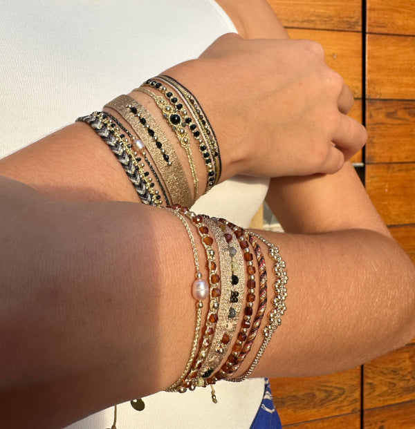 GOLDEN HANDWOVEN BRACELET FEATURING GEMSTONES AND GOLD DETAILS