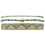SET OF THREE HANDMADE BRACELETS WITH TURQOUISE THREADS AND MULTICOLORED BEADS