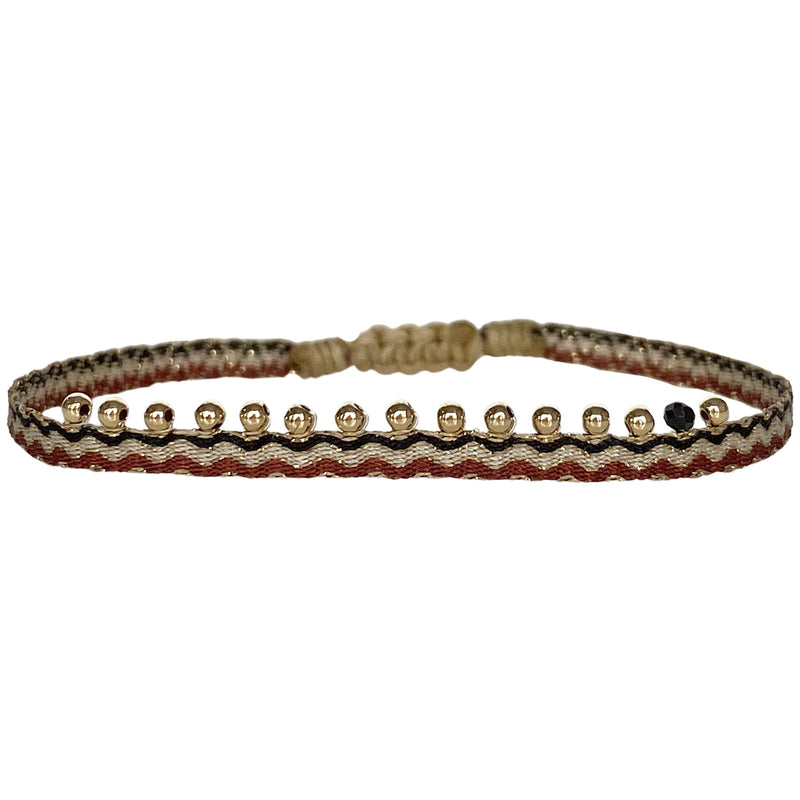 The Chic Handmade Bracelet Design Is Here. Entirely Unique, It's Set With a Beautiful Array Of  gold filled beads and a Spinel Semi-Precious Stone and handwoven using polyester.  Wear it solo or stacked it together with your favourite LeJu bracelets.  Details:  -Gold filled beads  -Spinel semi-precious stone  -Handwoven using polyester threads  -Adjustable bracelet   -Width:0.5 cm   - Women bracelet  -Can be worn in the water