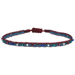COLOURFUL HANDWOVEN BRACELET IN RED TONES AND SILVER DETAILS