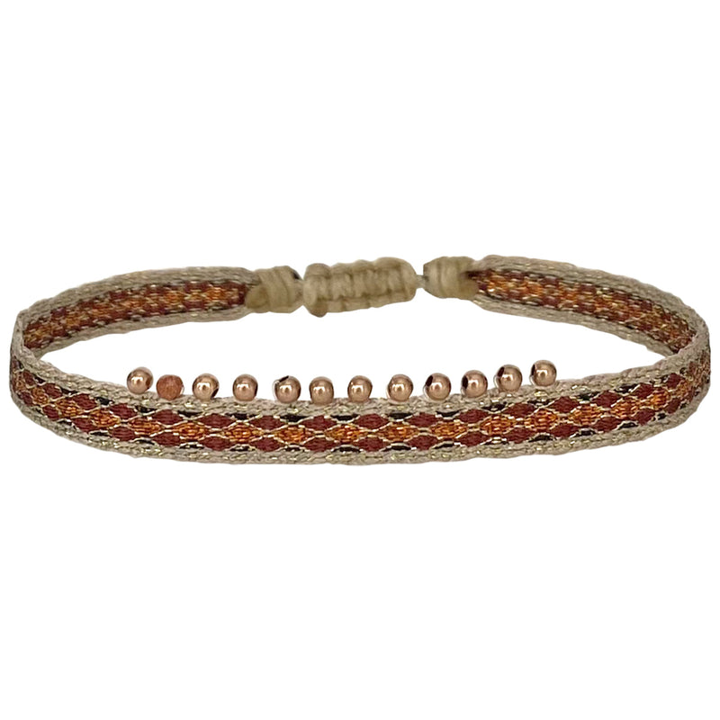 The new Chic bracelet design is here. Entirely Unique, It's set with a beautiful array of 14K rose gold beads and handwoven using polyester threads.  Wear it solo or stacked it together with your favourite LeJu bracelets.  Details:  -Rose gold filled beads  -Gold sandstone semi-precious stone  -Handwoven using polyester threads  -Adjustable bracelet   -Width:0.7 cm 