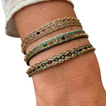      24 14k Gold filled beads     6 Semi Precious stones     Handwoven adjustable bracelet     Width 6mm