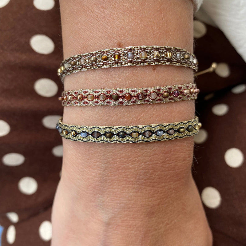 Details:  -14k rose gold filled  details   -Inter mixed semi-precious stone details   -Japanese glass beads  -Polyester threads  - Can be worn under water   - Adjustable bracelet  - Width: 6mm