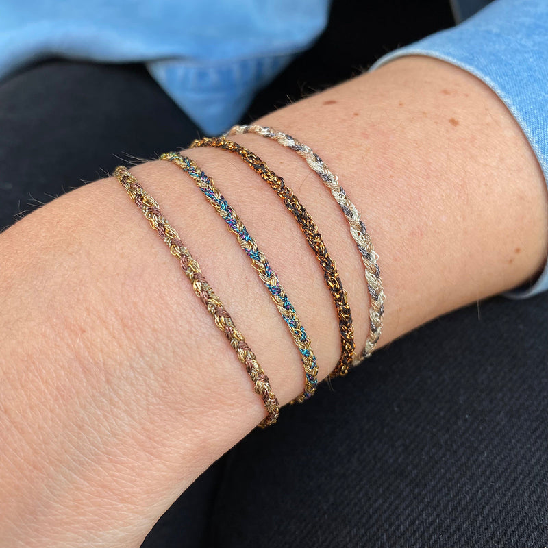 This handwoven beautiful creation makes this bracelet a unique piece using 14k gold filled chain. Wear them solo or together, depending on your mood.  Details:  - 14k gold filled CHAIN   - Gold metallic thread  - Adjustable Bracelet   - Width 4mm